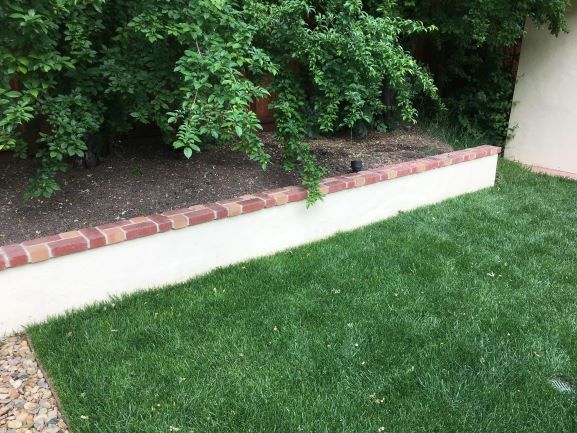 Picture of length of retaining wall with brick pattern