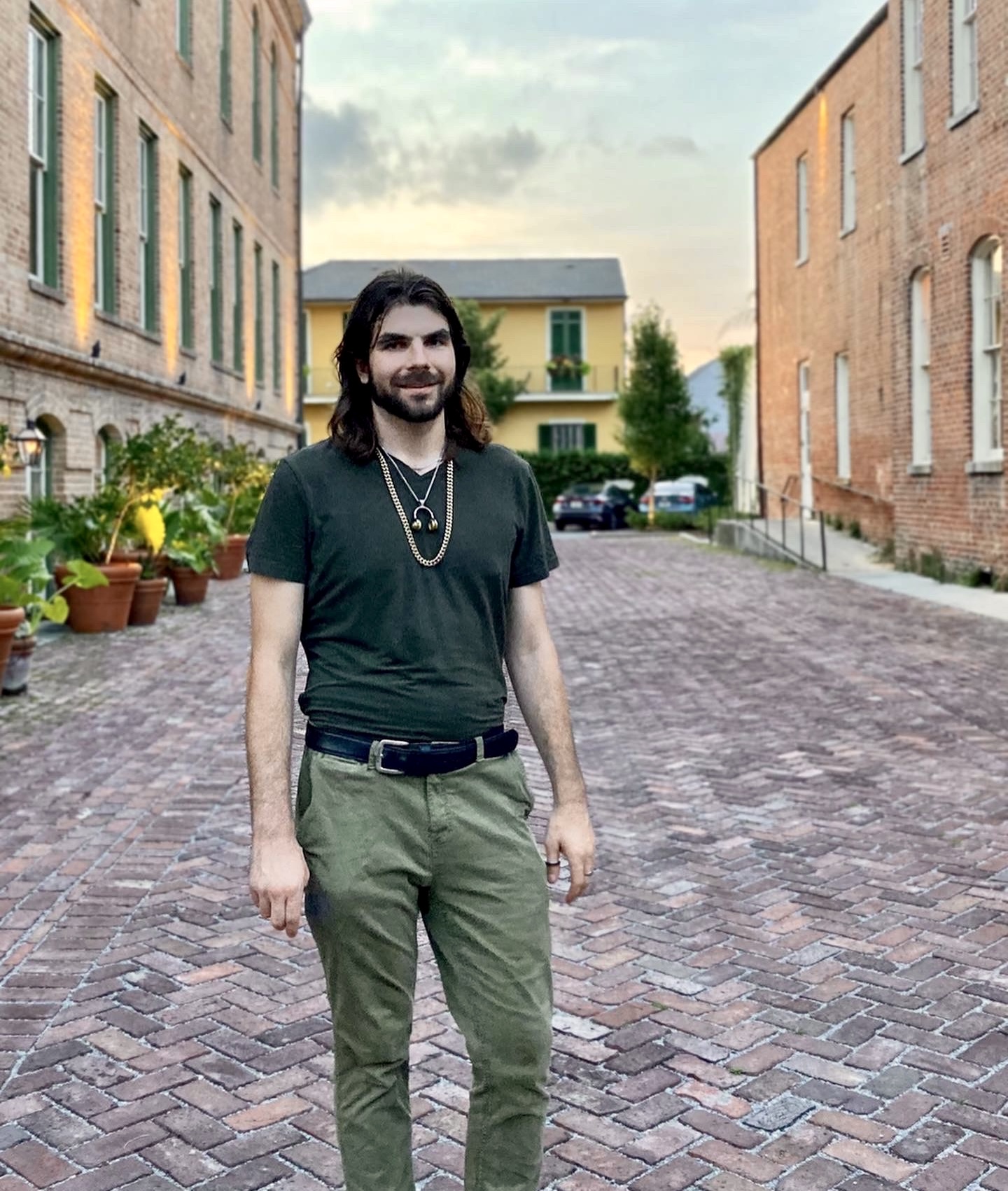 Omar Shishani standing in courtyard