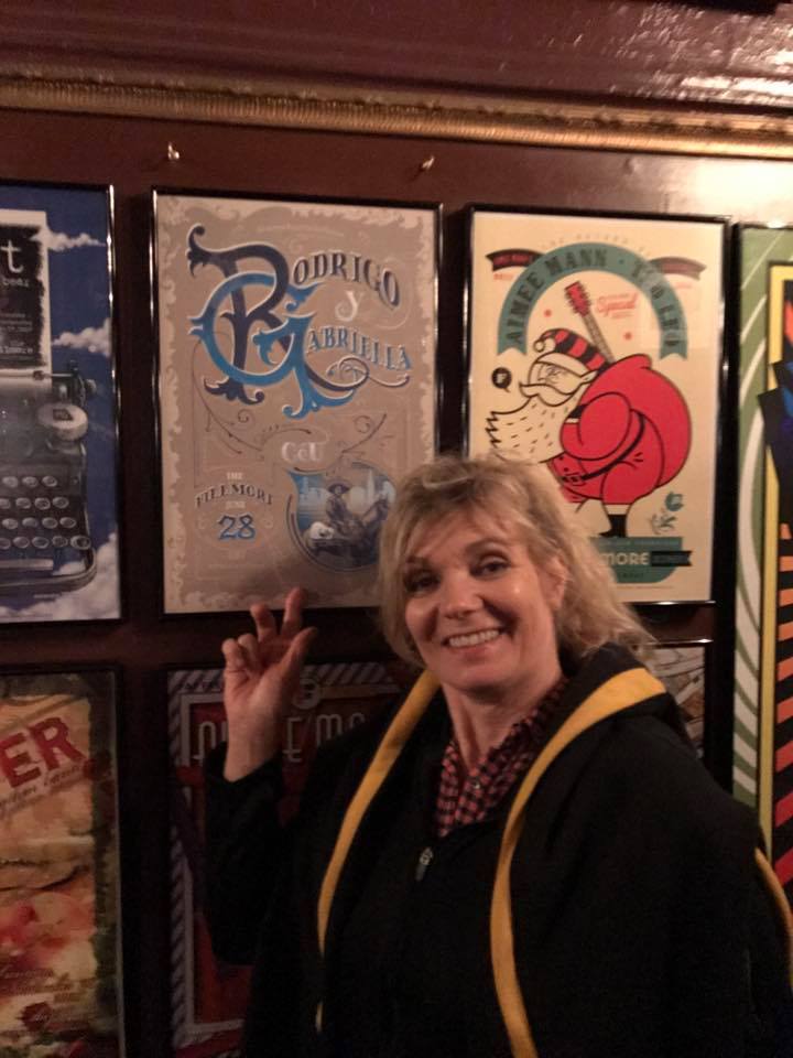 Picture of woman in front of designs.