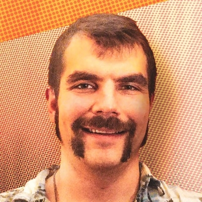 Portrait of man on orange background.