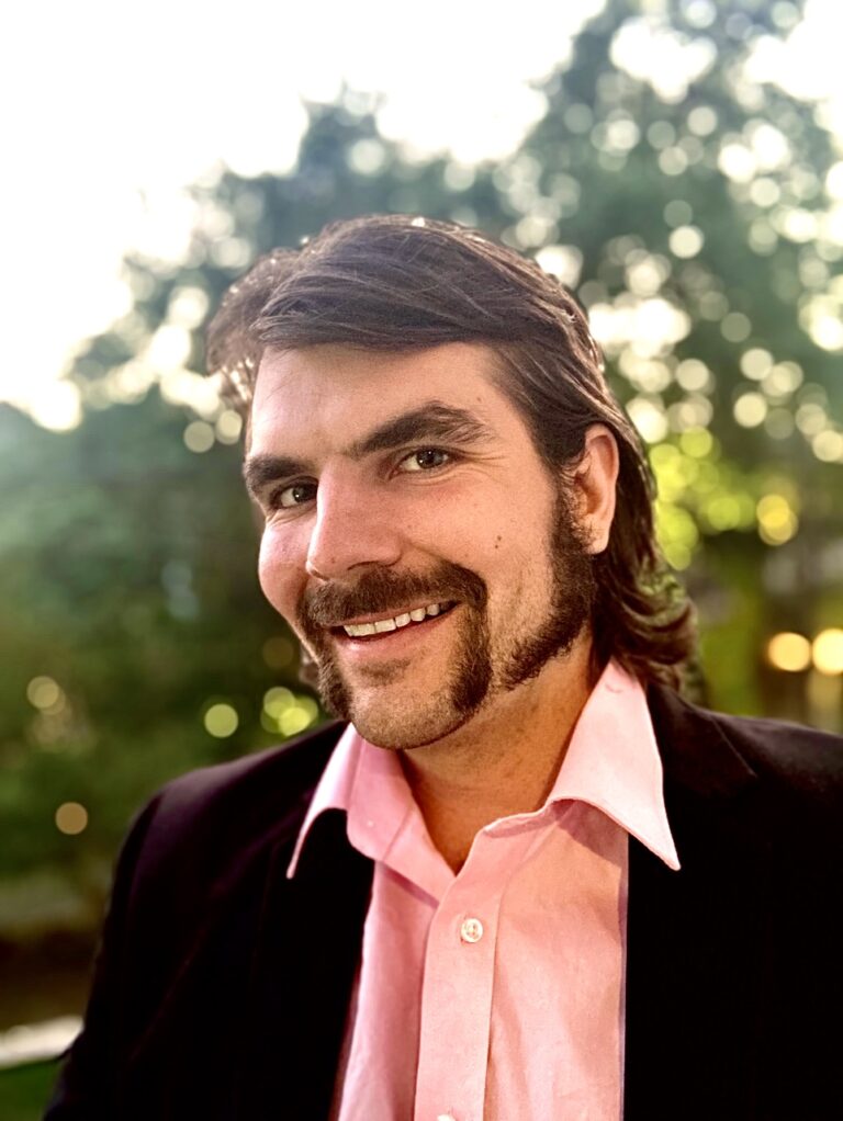 Omar Shishani wearing suit and pink shirt in New Orleans